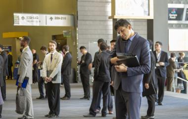 Student on phone in career fair