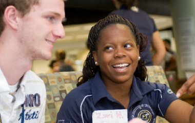 two students talking to each other