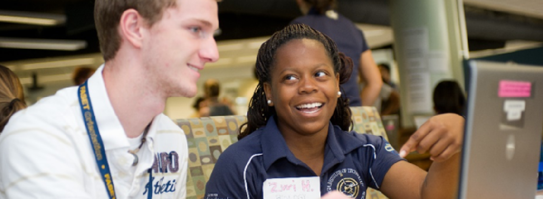 two students talking to each other